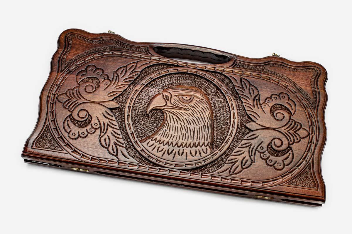 Carved beechwood backgammon board with a soaring eagle medallion and a carry handle, propped open