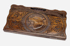 Carved beechwood backgammon board with a standing bear medallion and a carry handle, propped open