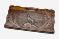 Carved beechwood backgammon board with a wolf medallion and a carry handle, propped open