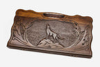 Carved beechwood backgammon board with a wolf medallion and a carry handle, propped open