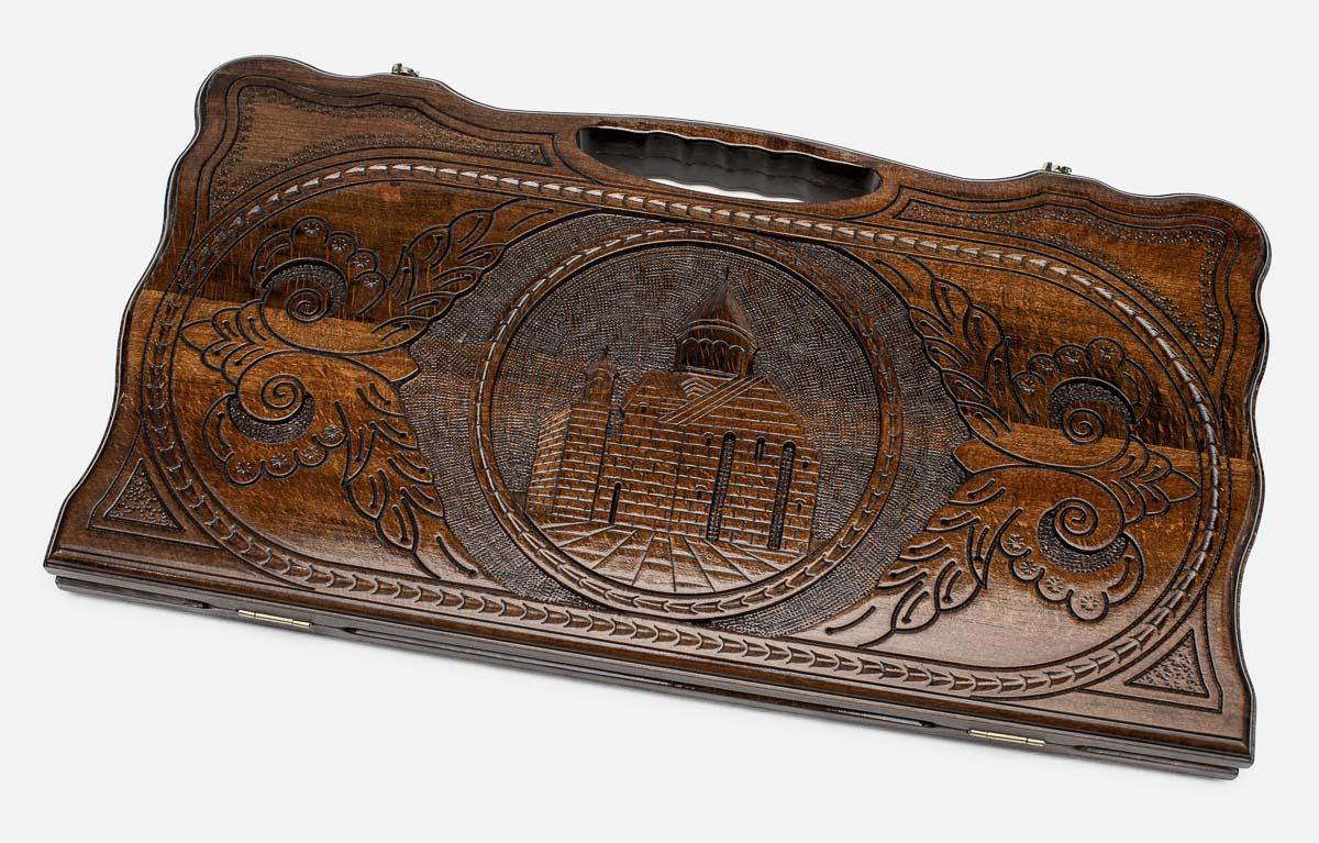 Carved beechwood backgammon board with the Geghard Monastery in a medallion, propped open