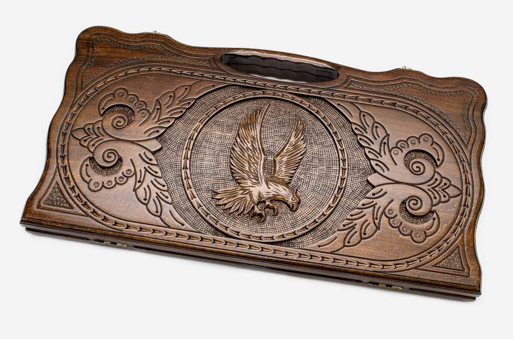 Carved beechwood backgammon board with an eagle medallion and a carry handle, propped open