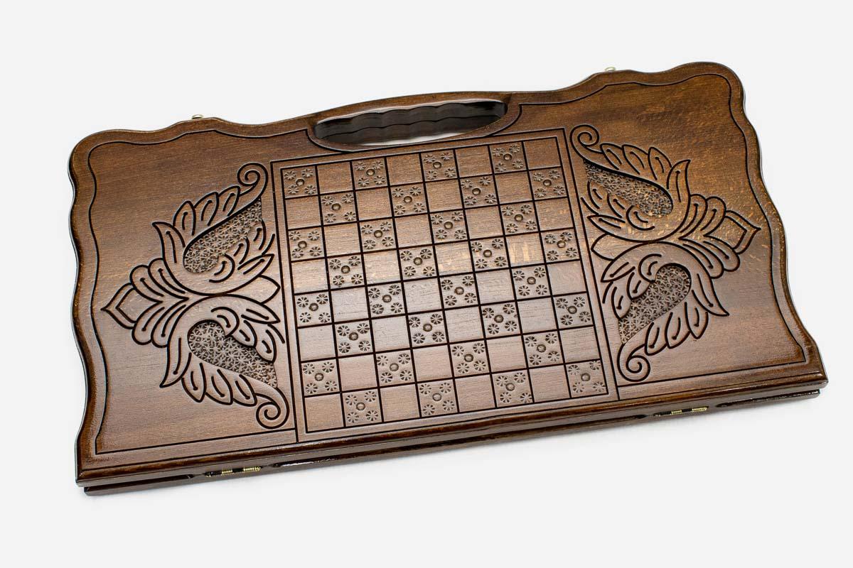 Angled view of the eagle medallion carved backgammon board