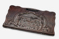 Carved beechwood backgammon board with a fisherman in a medallion, propped open