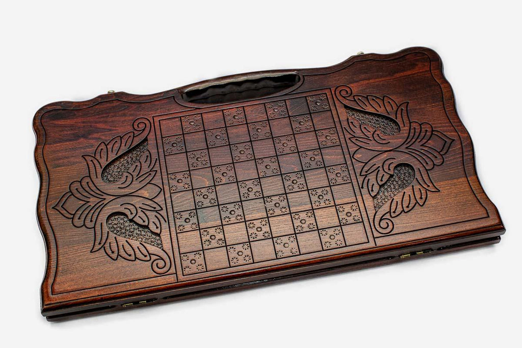 Angled view of the lion medallion carved backgammon board