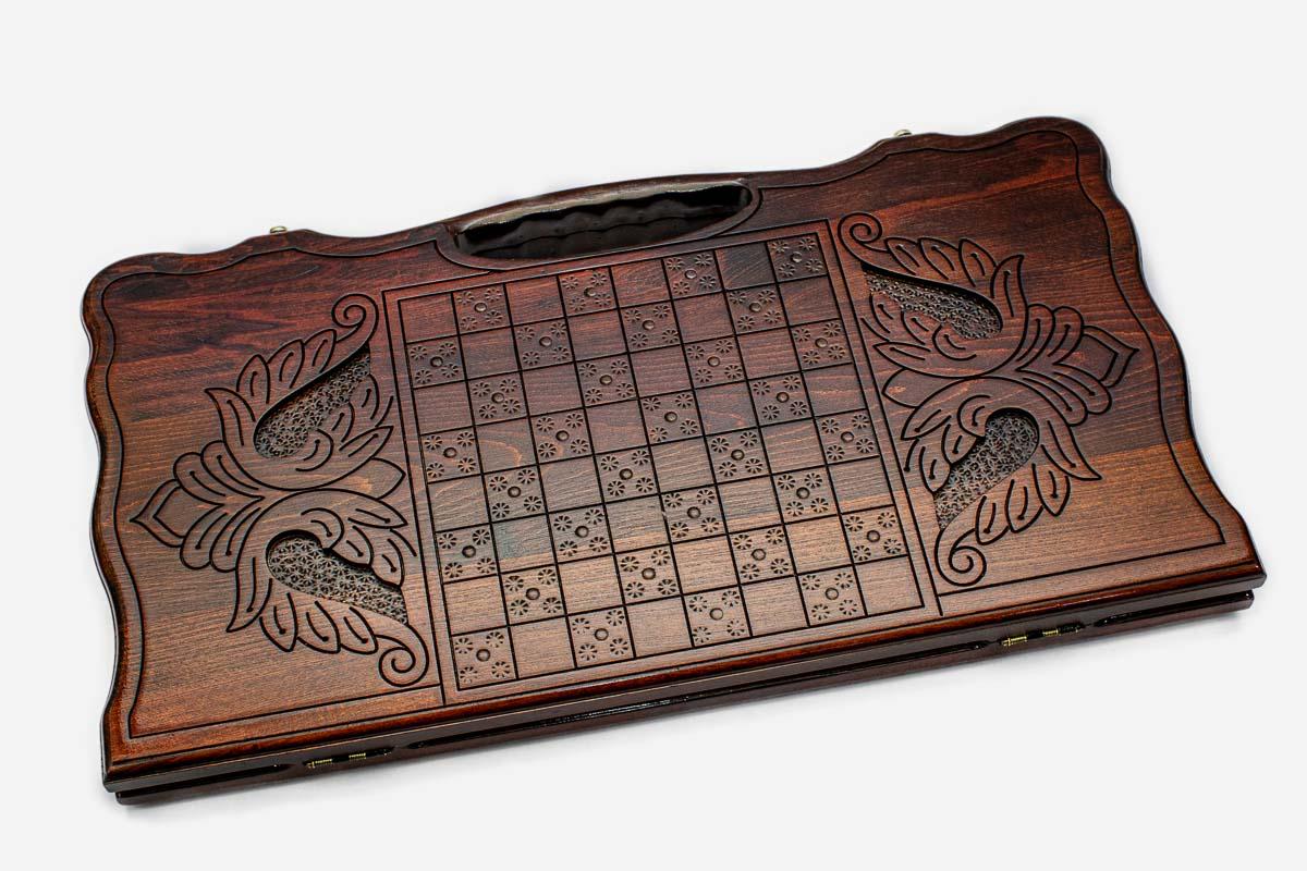 Angled view of the lion medallion carved backgammon board
