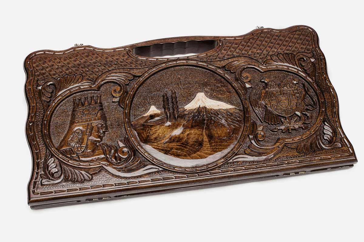 Carved beechwood backgammon board with Mount Ararat in a central medallion and two side scenes, propped open