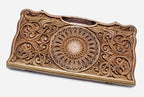 Master-carved walnut backgammon board with a central rosette and scrollwork, propped open