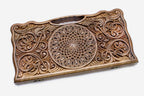 Angled view of the rosette and scrollwork master walnut backgammon board