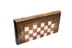 Classic chess and backgammon set - close-up of hand-carved chess pieces