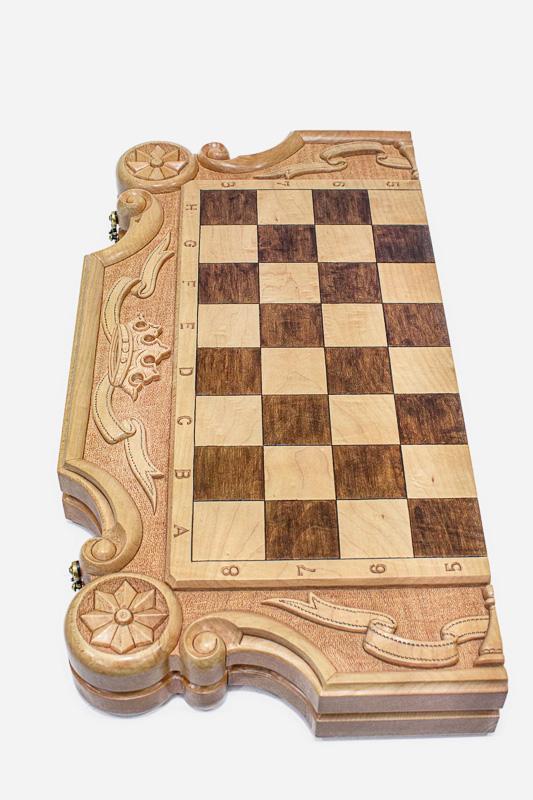 Detail of the bronze-topped chess pieces on the inlaid squares