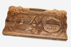 Carved walnut backgammon board with four scene medallions and a carry handle, propped open