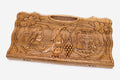 Carved walnut backgammon board with two scene medallions and a carry handle, propped open