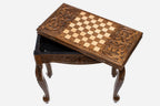 Handle Scrollwork table opening to reveal the backgammon storage compartment