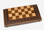 Carved chess set shown folded with carry handle