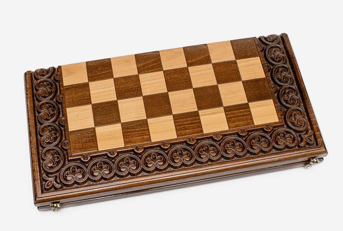 Carved chess set shown folded with carry handle
