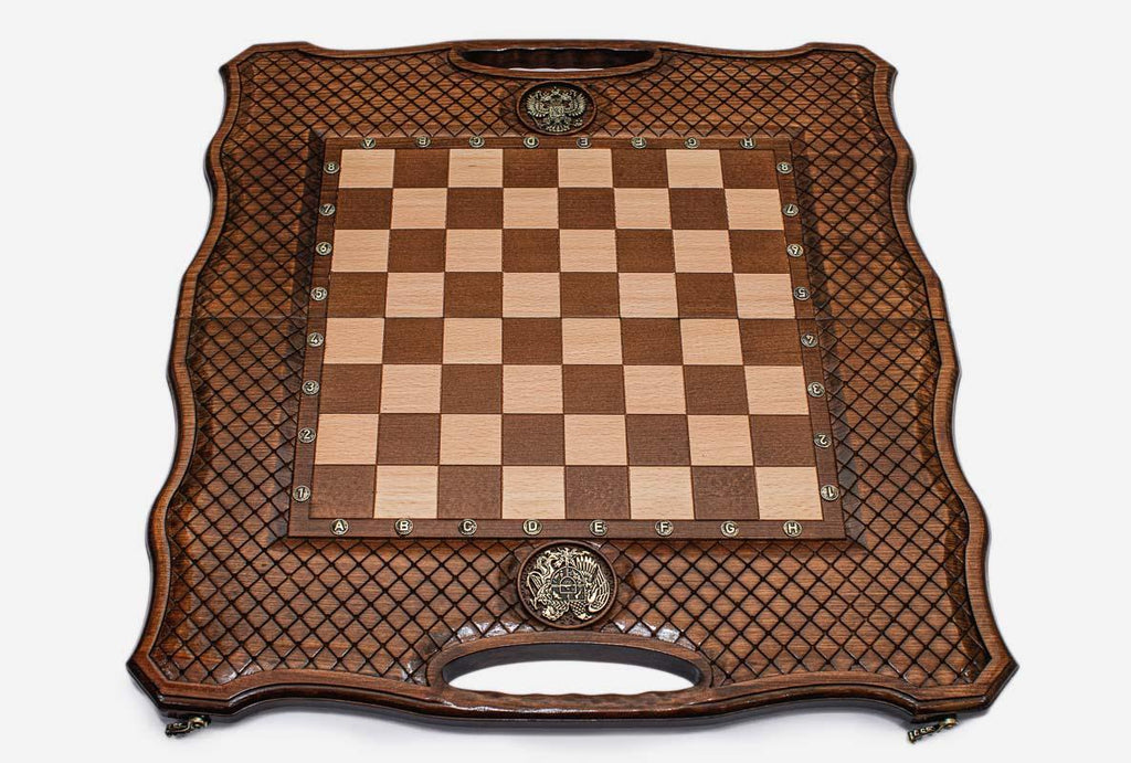 Angled view of the chess-backgammon set with its geometric wooden pieces