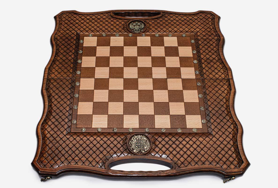 Angled view of the chess-backgammon set with its geometric wooden pieces