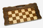 Classic chess and backgammon set shown folded with carry handle