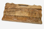 Carved walnut backgammon board with three scene medallions and a carry handle, propped open