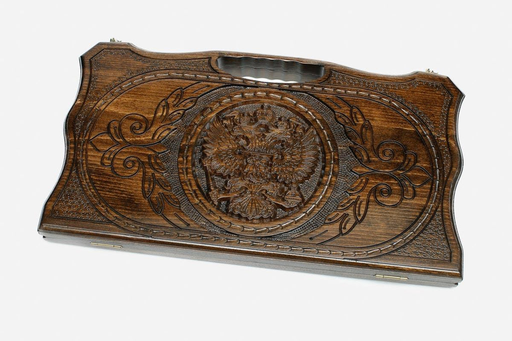 Compact carved beechwood backgammon board with the Russian coat of arms and a carry handle, propped open