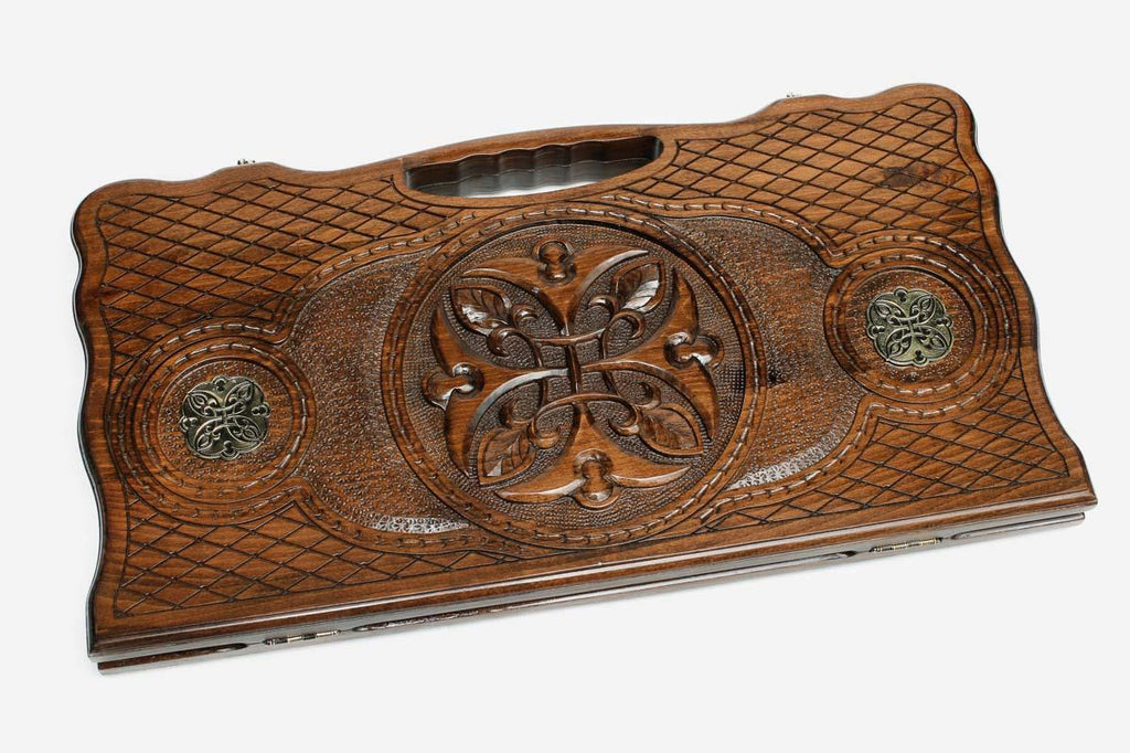 Angled view of the bronze rosette ornament backgammon board