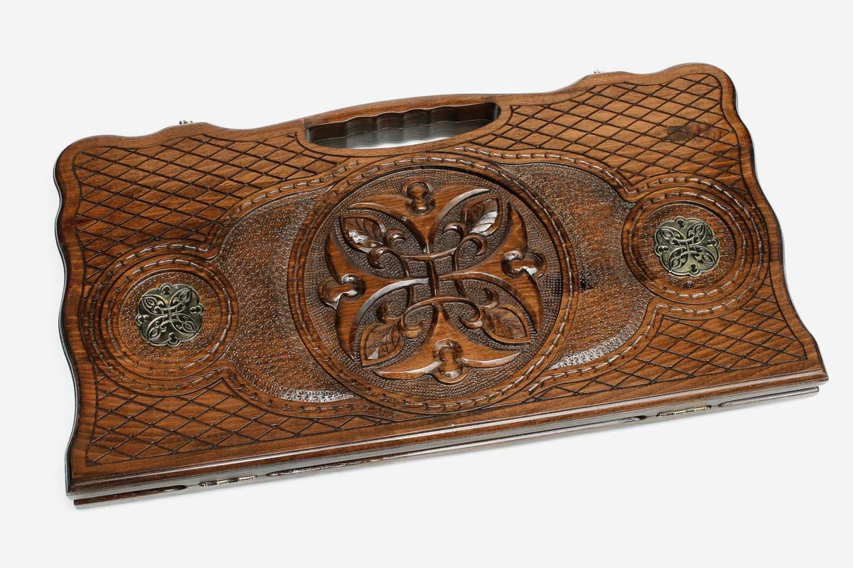 Angled view of the bronze rosette ornament backgammon board