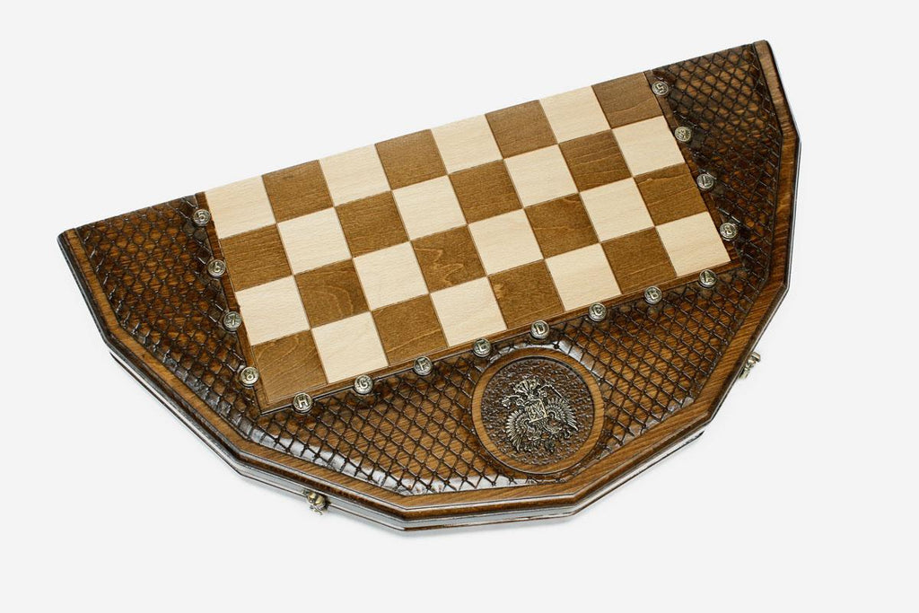 Angled view of the Russian coat-of-arms chess set with its gold and dark bronze pieces