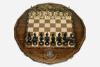 Twelve-sided carved chess board with a Russian double-headed-eagle medallion and ornate bronze figural pieces set up for play