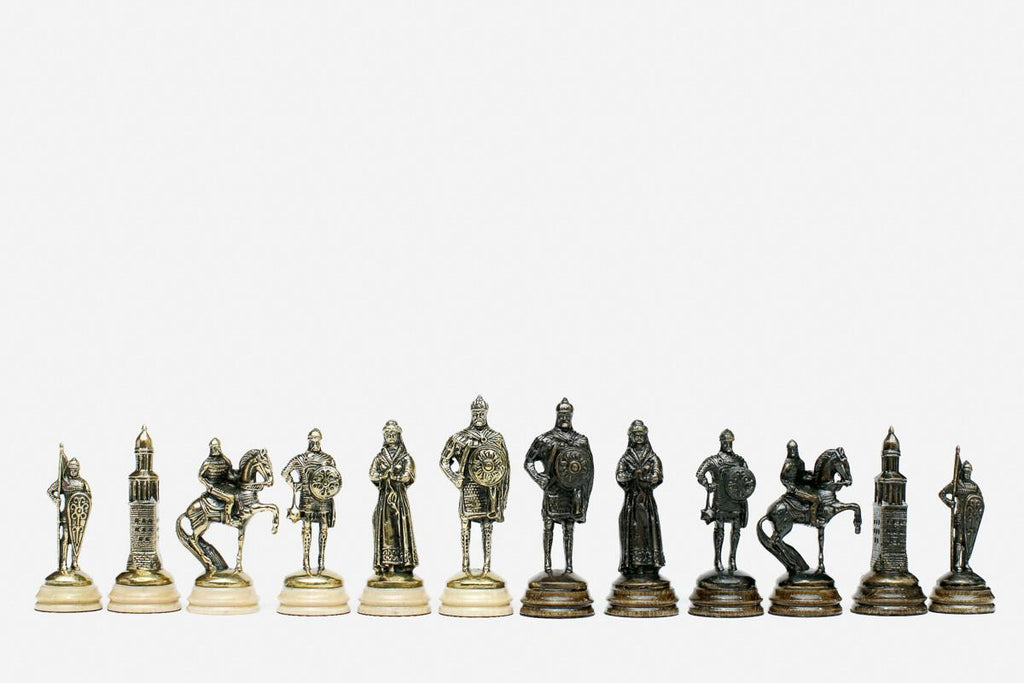 The carved Russian coat-of-arms chess board shown with both bronze armies