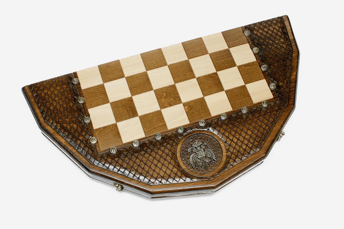 Angled view of the Russian coat-of-arms chess set with its dark and light wooden pieces