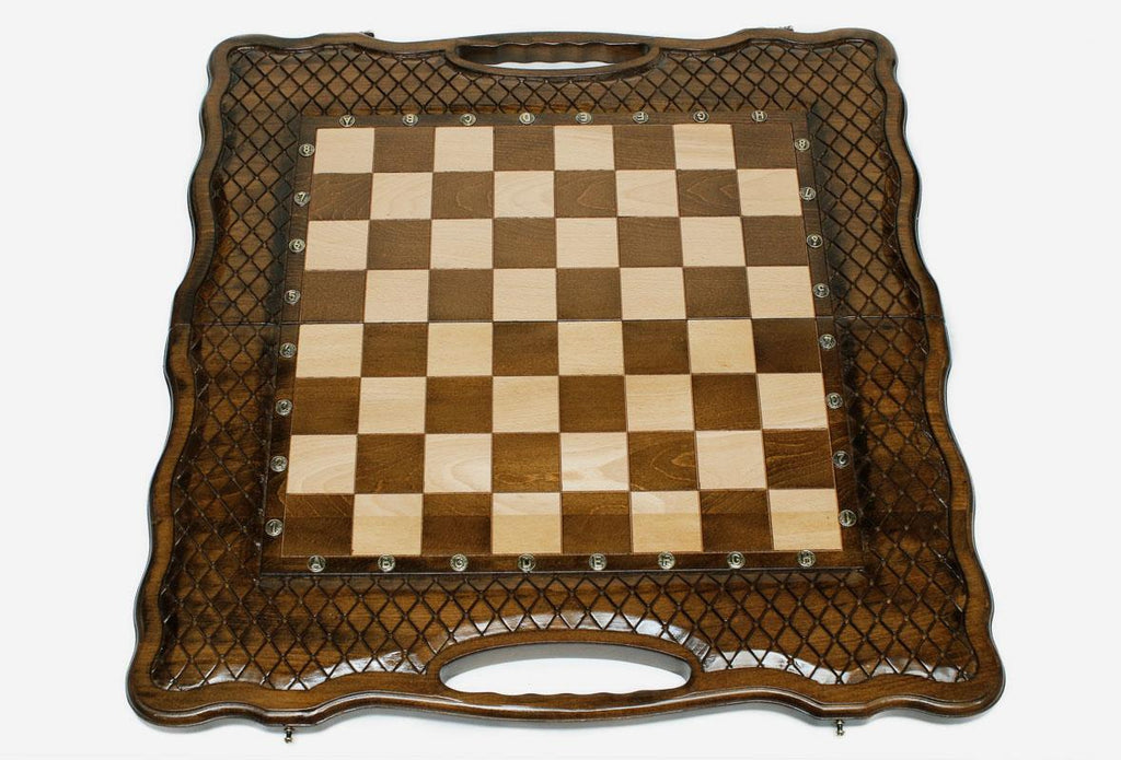Close-up of a baklava-lattice design carving on the beech board