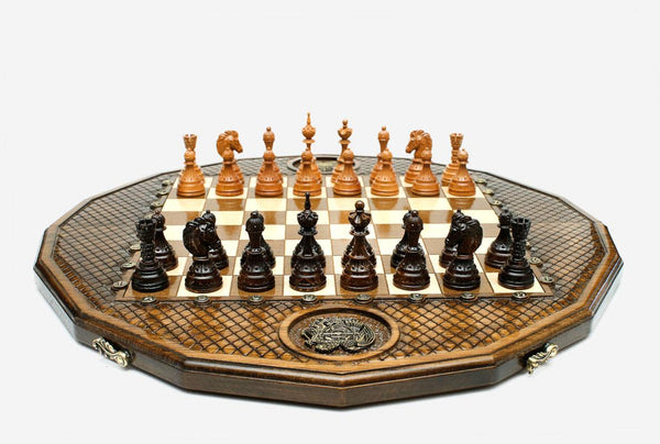 Twelve-sided carved chess board with inlaid coat-of-arms medallions and turned wooden pieces set up for play