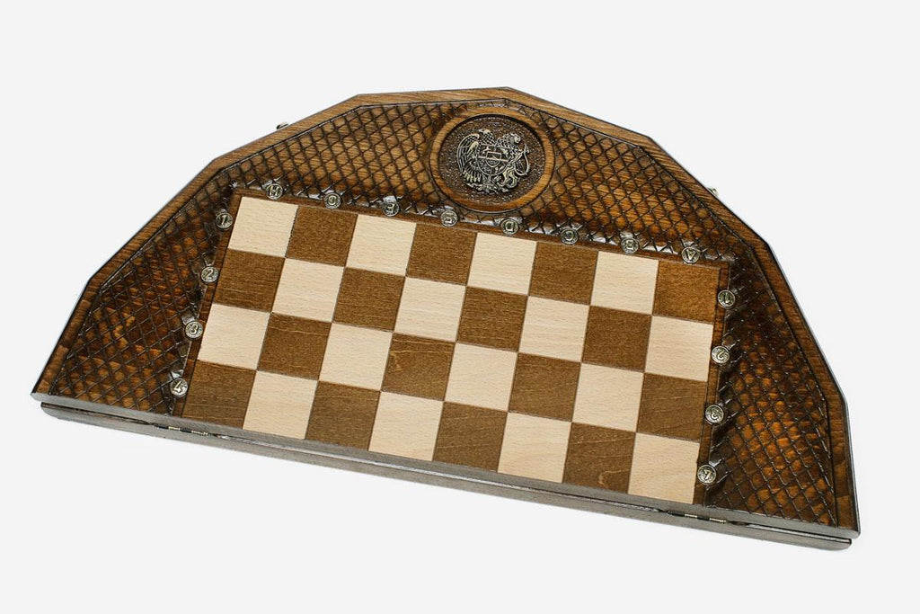 The carved coat-of-arms chess board shown with both bronze armies in starting position