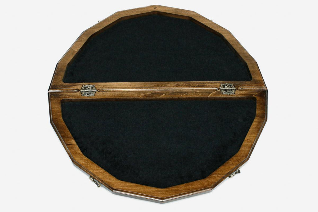 Close-up of the ornate bronze figural chess pieces on cream bases