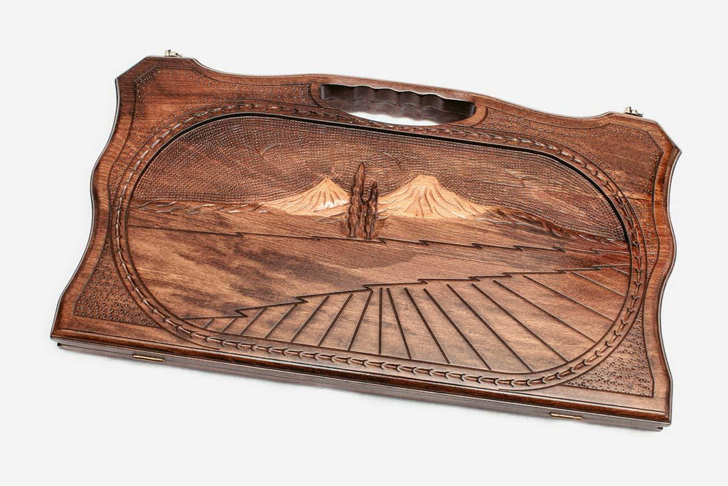 Carved beechwood backgammon board with Mount Ararat in a medallion and a carry handle, propped open