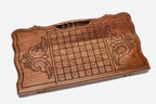 Angled view of the horse medallion carved backgammon board