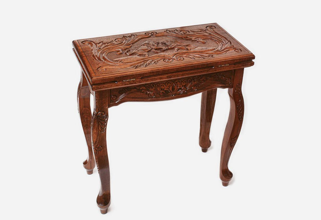 Close-up of the carved lions on the Handle backgammon table lid