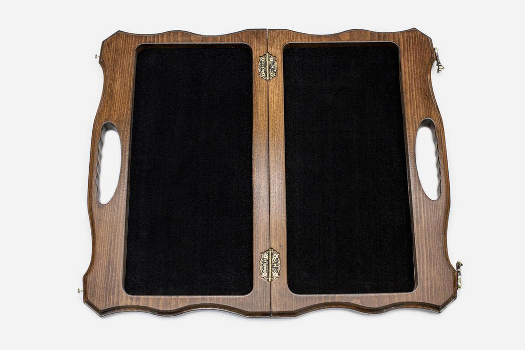Overhead view of the chessboard with the full set of light and dark pieces