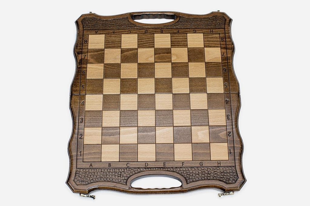 Close-up of the beech and walnut chess pieces on the inlaid squares