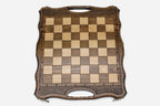 Close-up of the beech and walnut chess pieces on the inlaid squares
