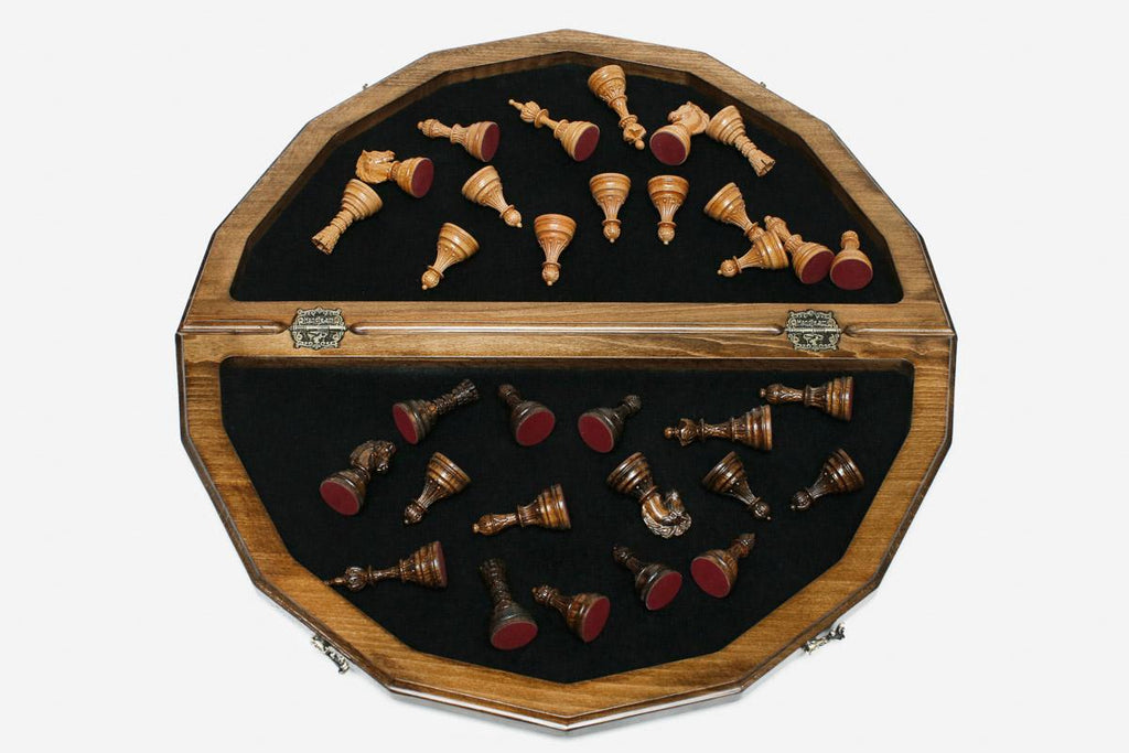 Overhead view of the polygonal board with the full set of light and dark pieces