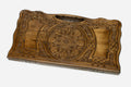 Carved beechwood backgammon board with a grand rosette medallion and knotwork panels, propped open