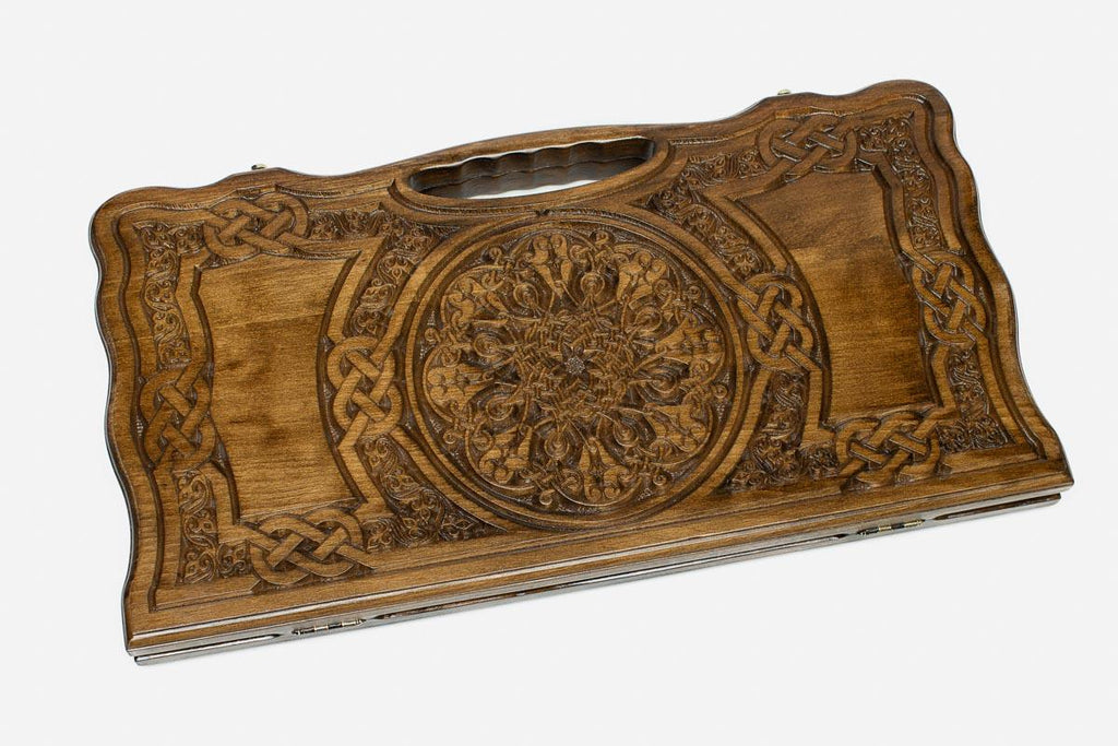 Angled view of the grand rosette carved backgammon board