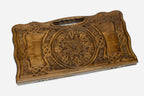 Angled view of the grand rosette carved backgammon board