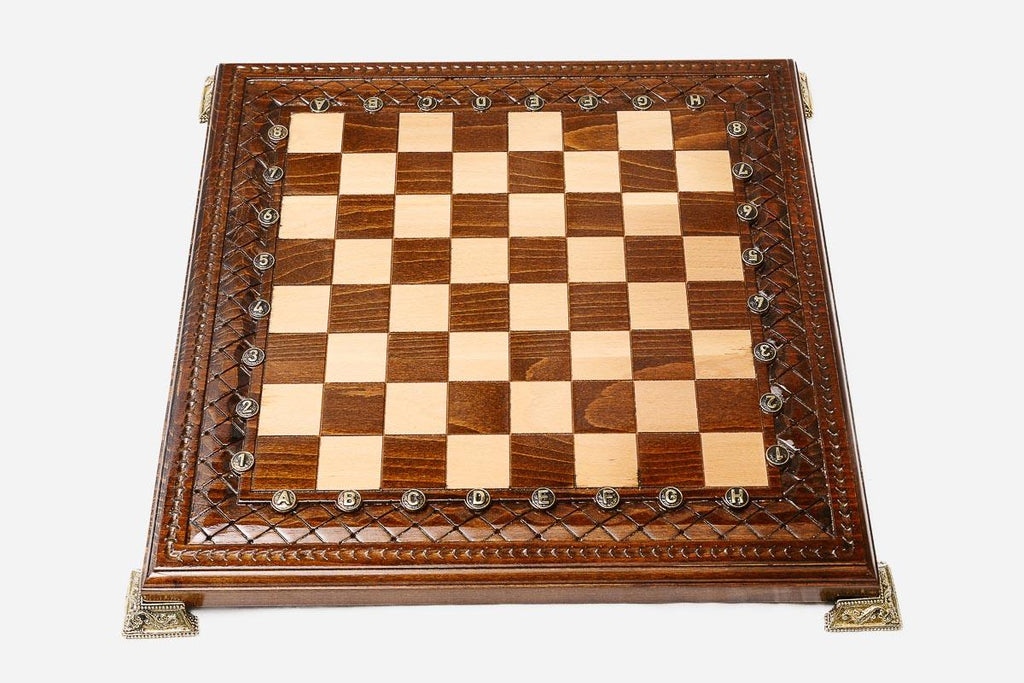 Carved chess set shown folded with carry handle