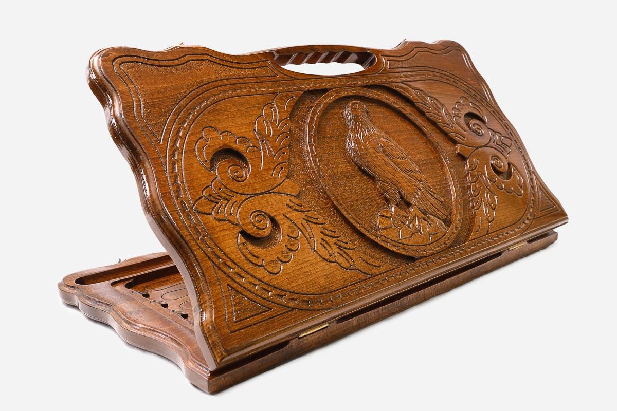 Carved beechwood backgammon board with a perched eagle medallion and a carry handle, propped open