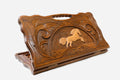 Carved beechwood backgammon board with a leaping horse medallion and a carry handle, propped open