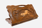 Carved beechwood backgammon board with a leaping horse medallion and a carry handle, propped open