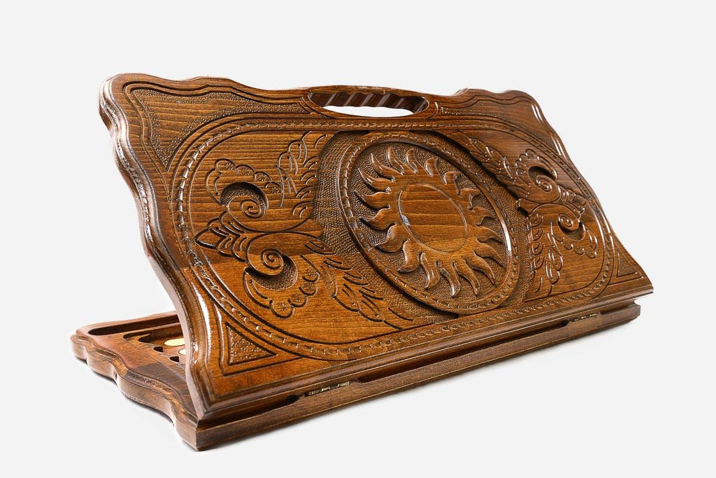 The backgammon board opened to show the wooden playing surface